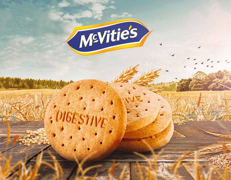 two cookies with the word mevites written on them in front of a wheat field