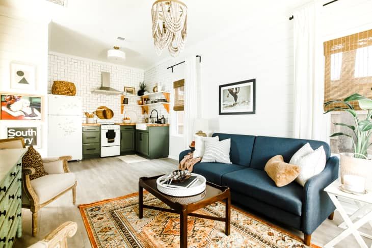 a living room filled with furniture and decor