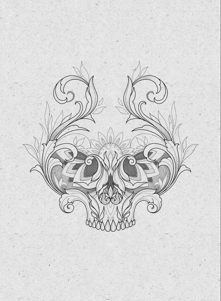 a black and white drawing of a skull with floral designs on it's face