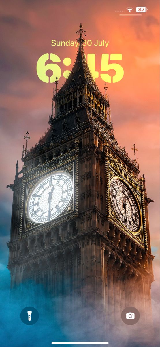 an image of the big ben clock tower in london, england with clouds around it