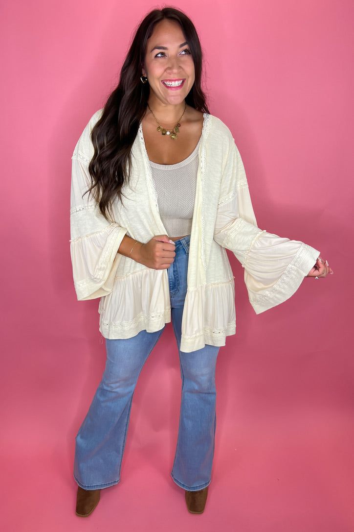 Super cute and even more soft cardigan- this piece is unique and will keep you stylish all year long. Stretchy and super soft material BEST SELLING BRAND ALERT: POL is known for their unique designs, super high quality materials and oversized, cozy fits. FIT: Runs oversized, size down if desired. Model is a size 8, wearing a size medium 71% Polyester, 23% Cotton, 6% Spandex Trendy V-neck Outerwear For Vacation, Trendy Long Sleeve Cream Cardigan, Long Sleeve Fall Sweater For Vacation, Long Sleeve Sweater For Vacation In Fall, Oversized V-neck Outerwear For Spring, Cream Long Sleeve Cardigan, Oversized V-neck Cardigan For Vacation, White Oversized Open Front Top, Spring Vacation Long Sleeve Sweater