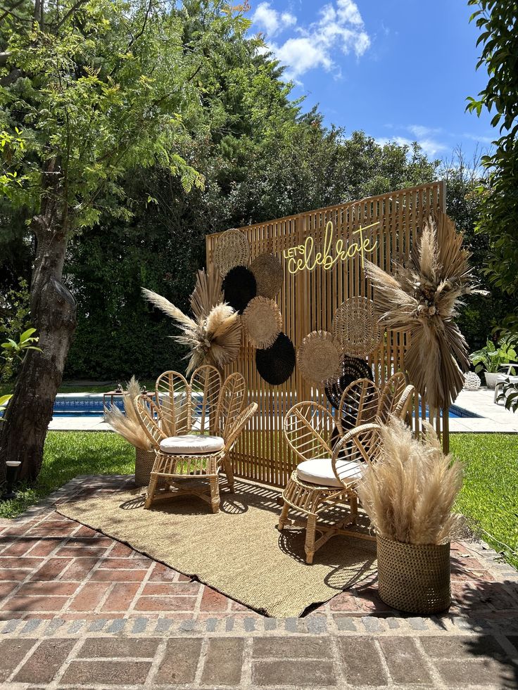 an outdoor area with wicker furniture and plants