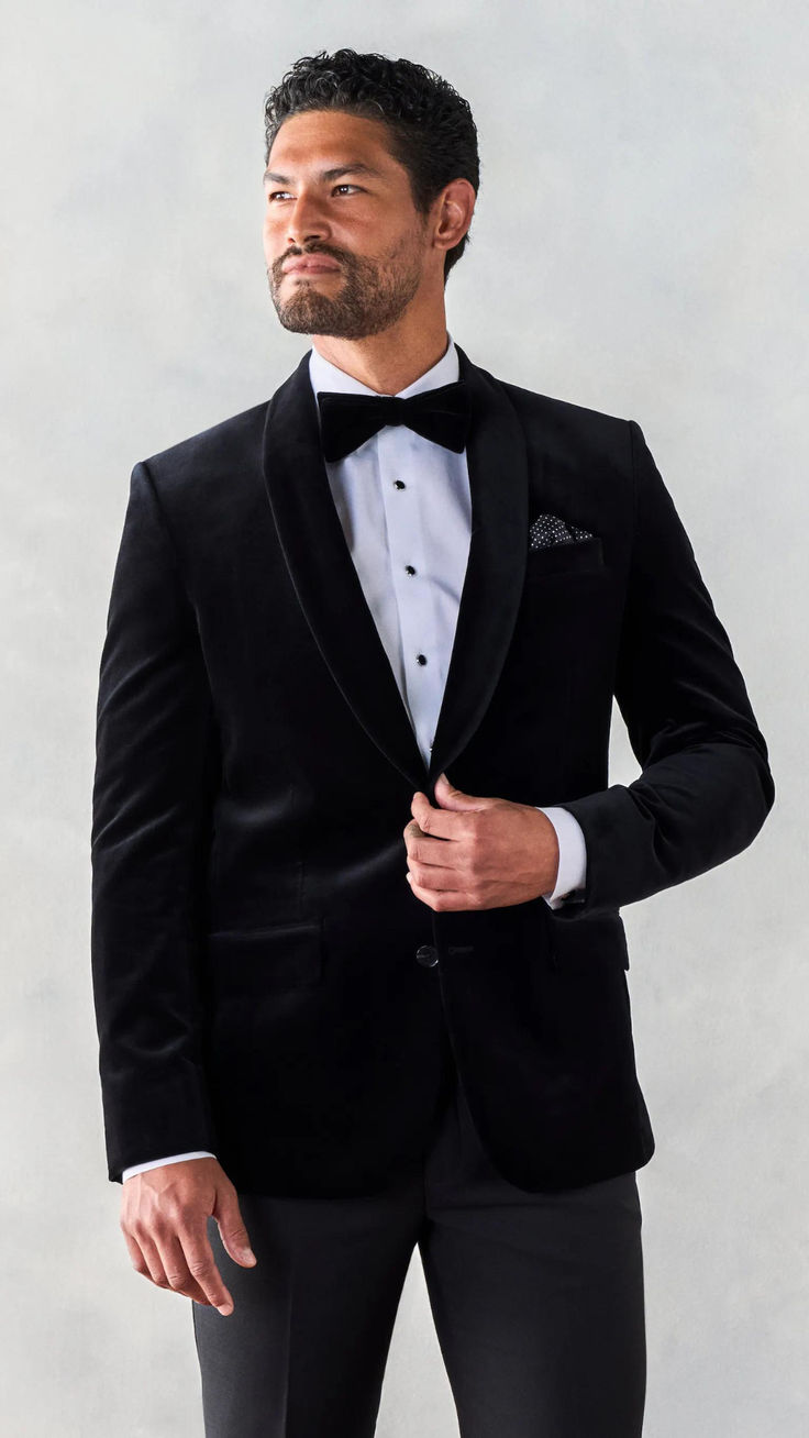 Winter Tuxedo Inspiration- We're really feeling this lightweight velvet jacket tuxedo. With its rich texture and statement-making shawl collar, you're sure to stand out for all the right reasons. Includes jacket and pants. 76% Cotton, 24% Bamboo Two-button closure Shawl collar Side vents Fully canvassed Elegant Single Breasted Outerwear For Black-tie Events, Elegant Single-breasted Outerwear For Black-tie Events, Tuxedo Style Long Sleeve Outerwear For Black-tie Events, Long Sleeve Tuxedo For Black-tie And Festive Events, Festive Long Sleeve Tuxedo For Black-tie Events, Festive Tuxedo For Black-tie Events, Fitted Lapel Collar Outerwear For Black-tie Events, Festive Fitted Blazer For Black-tie Events, Fitted Blazer For Black-tie Festive Events