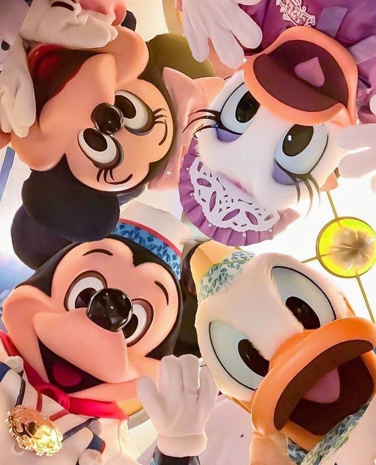 several mickey mouse masks are stacked on top of each other with their mouths wide open