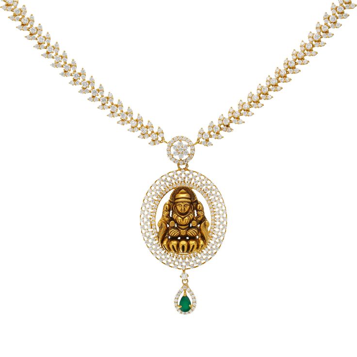 The rich array of cz stones and gleaming emerald adda high shine and luster to this 22k yellow gold temple necklace. Features • 22k yellow gold • Cubic zirconia • Emerald Virani Jeweler's 22k gold necklace collection brings together the beauty and significance of Indian culture and traditions. Find beautiful Indian jewelry like this gold necklace on our website. Specifications • Minimum Necklace Width - 1 millimeters • Maximum Necklace Width - 62 millimeters • Necklace Length - 21 inches • Weigh Luxury Fusion Style Temple Necklace In 22k Gold, Luxury 22k Gold Spiritual Necklace, Luxury 22k Gold Temple Necklace With Cutdana, Luxury Gold Emerald Necklace For Diwali, Luxury Temple Necklace In Yellow Gold With 17 Jewels, Luxury Yellow Gold Emerald Necklace In Temple Style, Luxury Yellow Gold Temple Necklace For Festive Occasions, Luxury Gold Jeweled Temple Necklace, Green Tilla Temple Necklace Luxury