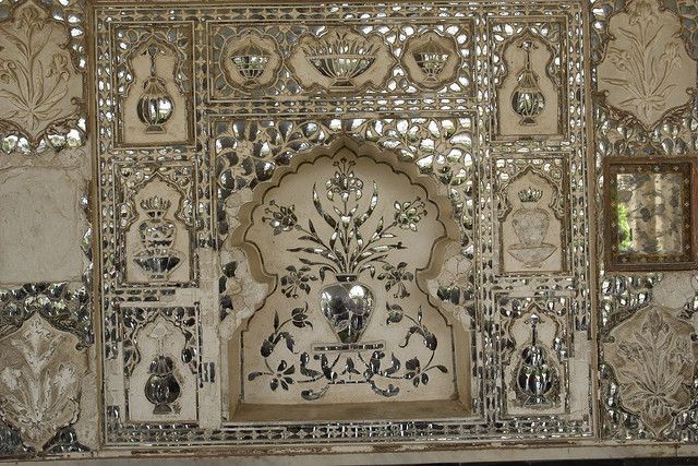 an intricately decorated wall with metal decorations