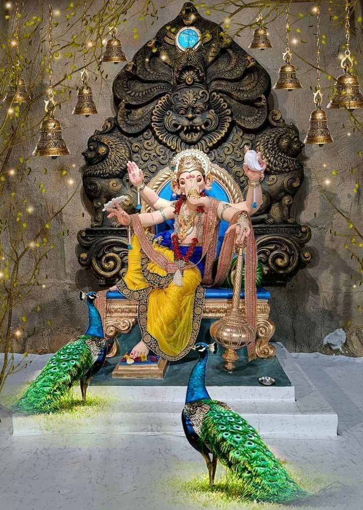 there is a statue of a woman sitting on a throne with peacocks