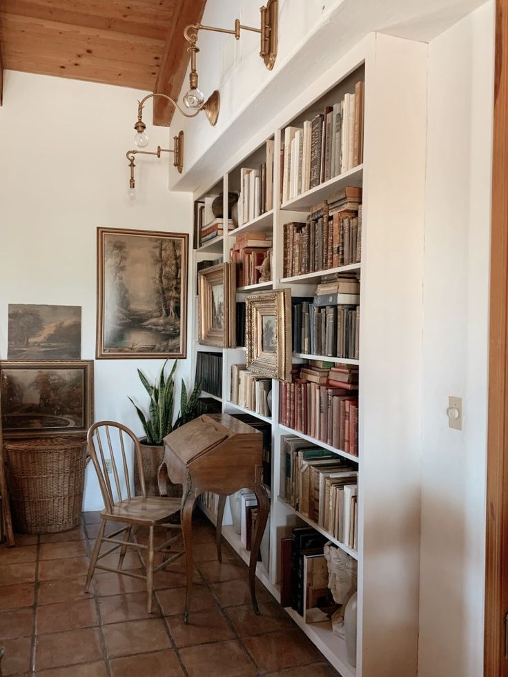 a room with many books on the shelves