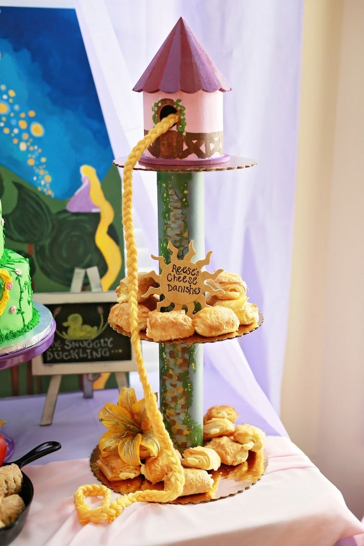 three tiered trays filled with pastries on a table