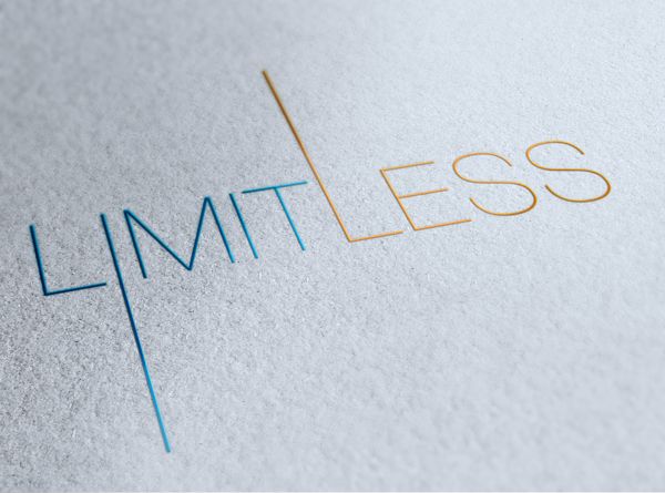 the word limitless is written in gold and blue on a white surface with an orange line