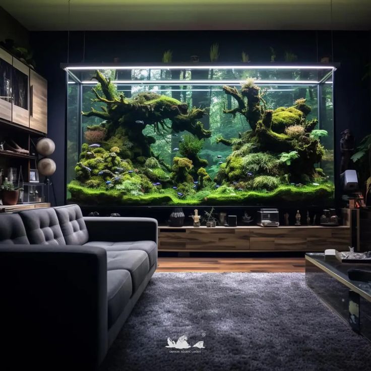 a living room filled with furniture and a large aquarium in the middle of it's wall