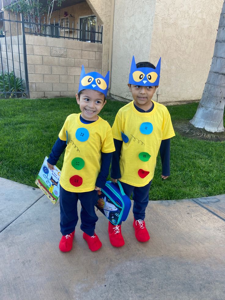 two young boys dressed up in costumes for halloween