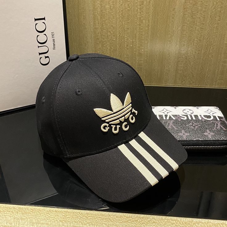 SHOP MORE LUXURY PRODUCTS HERE Description Gucci x Adidas Baseball Hat Black GG Hat Part of the adidas x Gucci collection, this baseball hat features Gucci Trefoil embroidery. Emblematic HouseÃƒÂ¯Ã‚Â¿Ã‚Â½ÃƒÂ¯Ã‚Â¿Ã‚Â½ÃƒÂ¯Ã‚Â¿Ã‚Â½ÃƒÂ¯Ã‚Â¿Ã‚Â½ÃƒÂ¯Ã‚Â¿Ã‚Â½ÃƒÂ¯Ã‚Â¿Ã‚Â½ÃƒÂ¯Ã‚Â¿Ã‚Â½ÃƒÂ¯Ã‚Â¿Ã‚Â½s motifs mix with those of the historic sportswear brand adidas. The collection sees both heritages encoded in a trio of lines, where adidas and Gucci combine archival emblems. Creative Director, Alessandro Miche Adidas X Gucci, Gucci X Adidas, Gucci Collection, Dior Shirt, Gucci Shirt, Louis Vuitton Shirt, Chanel Shirt, Gucci Hat, Gucci Gg Marmont