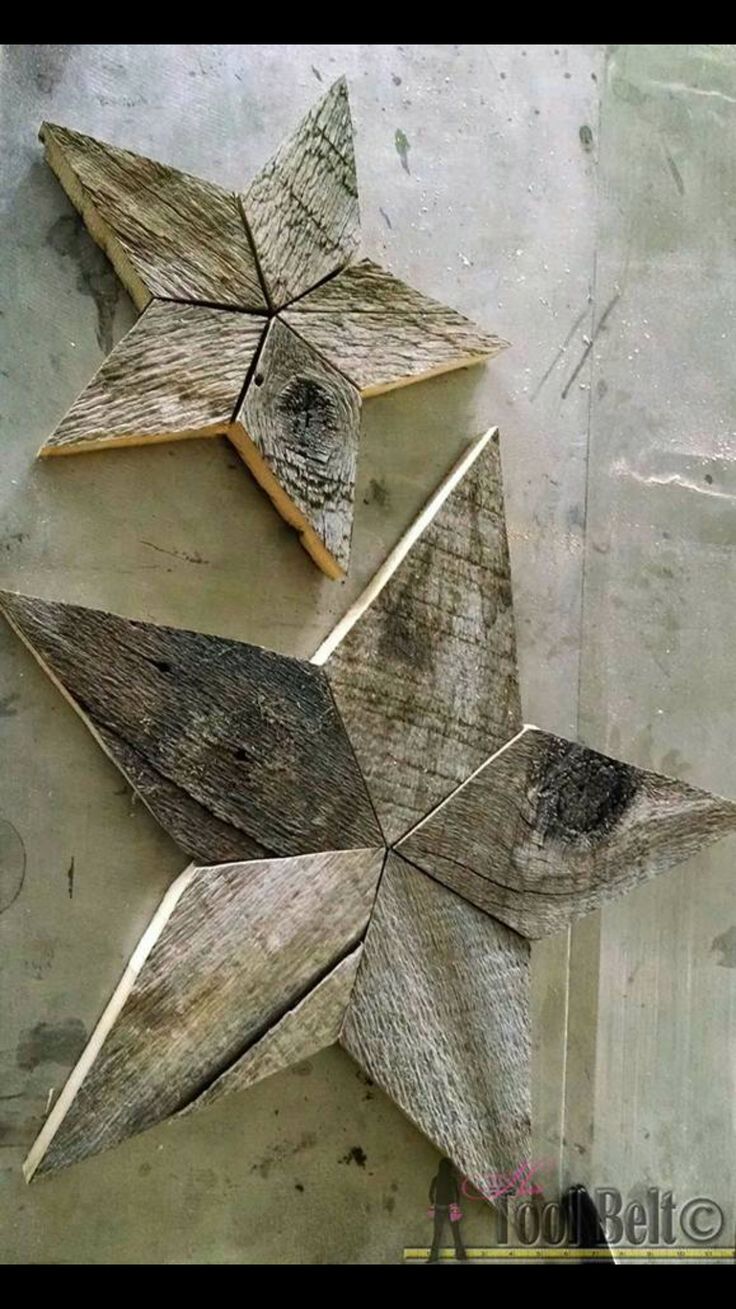 three wooden stars are arranged on the wall