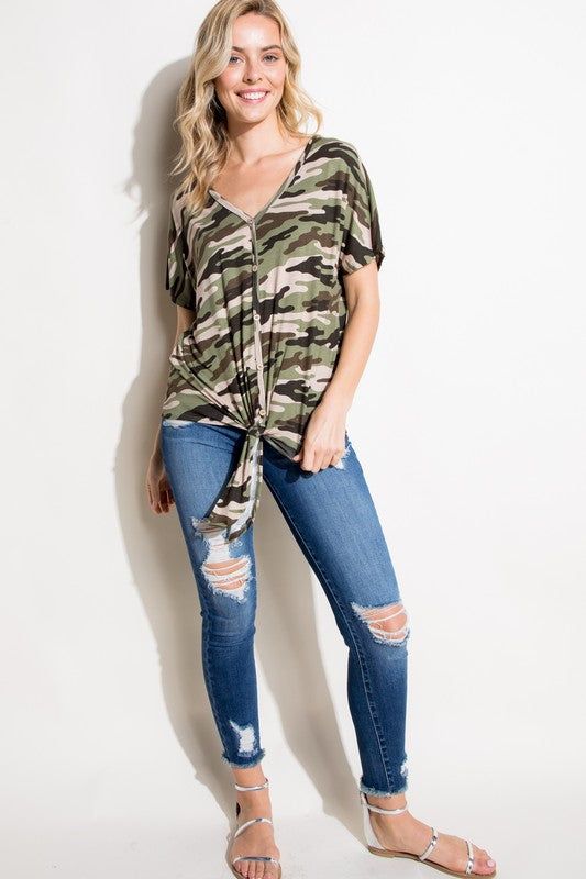 CAMOUFLAGE PRINT V NECK BUTTON DOWN FRONT SHORT SLEEVE FRONT TIE BOTTOM PLUS TOP95% RAYON, 5% SPANDEX MADE IN USA1X/2X/3X 2-2-2 Style: Casual Print / Pattern: CAMOUFLAGE PRINT Fit: Regular Neck Line: V NECK Sleeve: SHORT SLEEVE Closure: FRONT TIE BOTTOM Lining: No Made In: Made In U.S.AFabric Contents: 95% RAYON, 5% SPANDEXNon-sheer fabricCare Instructions: Machine wash cold, do not bleachSize Measurement (inch): 1X: 44.0-46.0 (Bust), null (Waist), null (Hips), null (Length) 2X: 46.0-48.0 (Bust) Casual Camouflage Tops For Spring, Trendy Short Sleeve V-neck Top For Fall, Summer Stretch Camouflage Tops, Spring Stretch Camouflage Top, Trendy Camouflage Tops For Spring, Casual Short Sleeve V-neck Top For Fall, Trendy Camouflage Summer Top, Trendy Summer Camouflage Top, Trendy Camouflage Tops For Summer