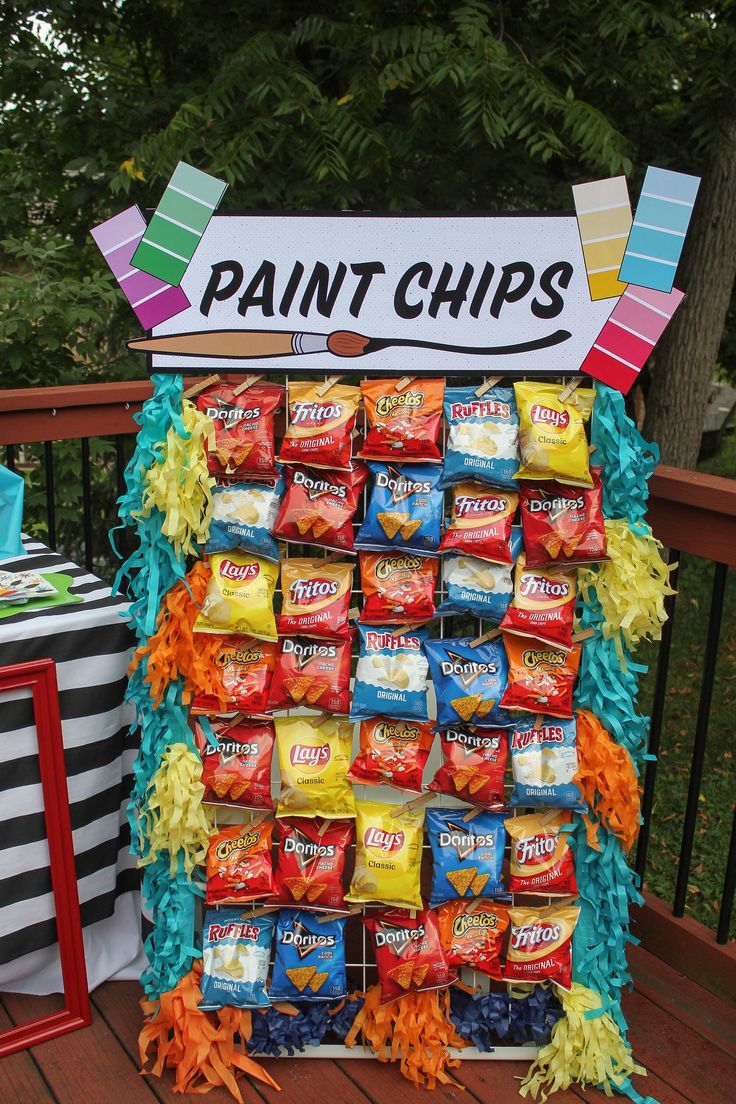 a display made out of candy bar wrappers and paint chips