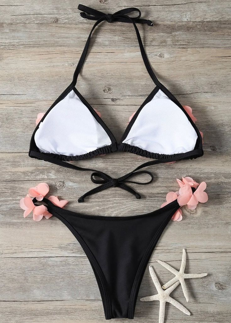 This Petals Trim Two-Piece Bikini Swimsuit is perfect for a day at the beach. Crafted with a pink and black color scheme, this swimsuit provides durability with its clorine-resisting fabric, resisting fading and wear for extended use. Show off your style in the sun with this unique two-piece bikini. Swimwear cannot be returned or exchanged. Black Beachwear Swimwear For Vacation, Black Beachwear For Vacation, Black Triangle Top Swimwear For Summer, Stretch Black Swimwear For Beach, Black Stretch Swimwear For Beach, Black Swimwear For Beach Season, Black Tie-side Bottom Swimwear For Beach, Black Beachy Swimwear For Summer, Black Tie-side Swimwear For Beach