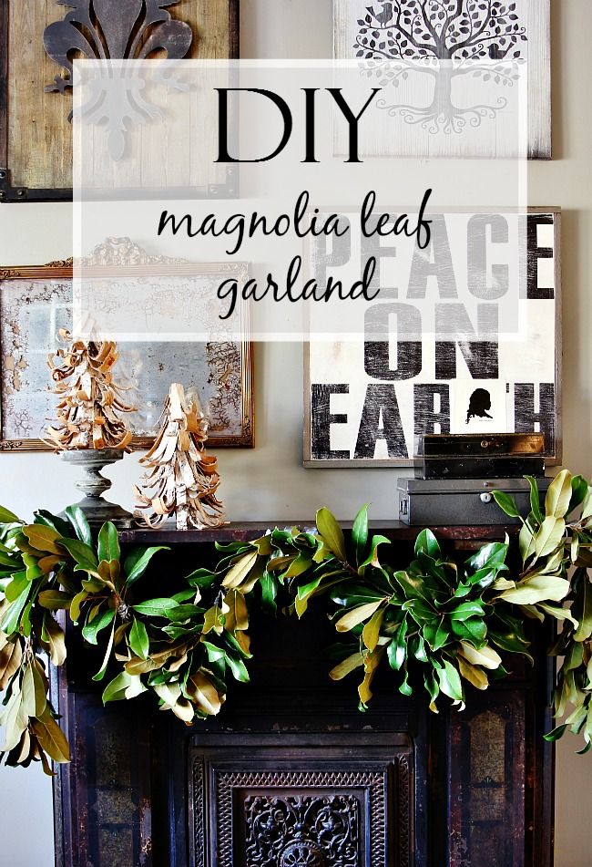 an old fireplace mantel decorated for christmas with greenery