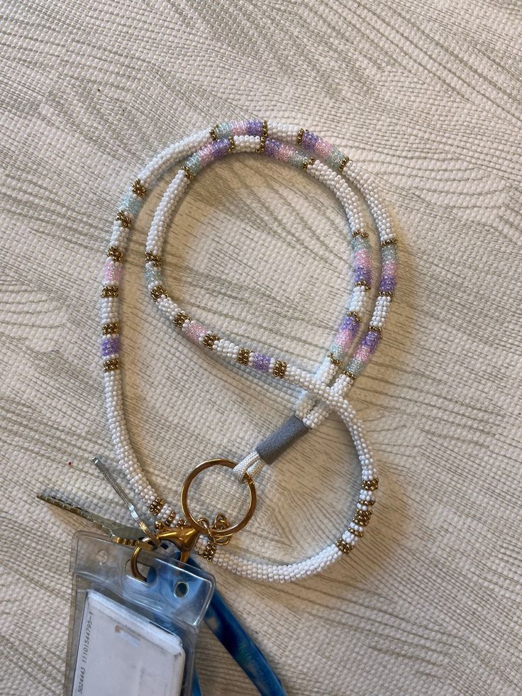 Native beaded lanyard. Full length beaded lanyard. Price will vary by size and designs. Feel free to message and ask for different patterns, sizes or colors :) White Beaded Everyday Jewelry, White Beaded Jewelry For Everyday Use, Adjustable White Lanyard With Key Leash, White Adjustable Lanyard With Key Leash, Adjustable White Lanyard, White Round Beaded Necklaces For Everyday, Handmade White Lanyards As Gifts, Handmade White Lanyards For Gift, Handmade White Lanyard For Gift