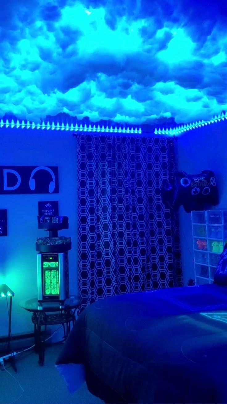 a bedroom with blue lighting and clouds in the ceiling