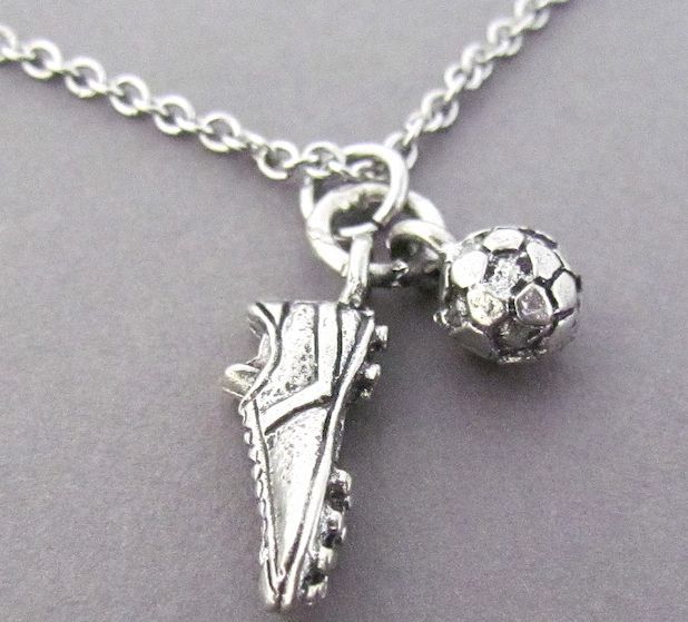 a soccer shoe and ball charm on a chain