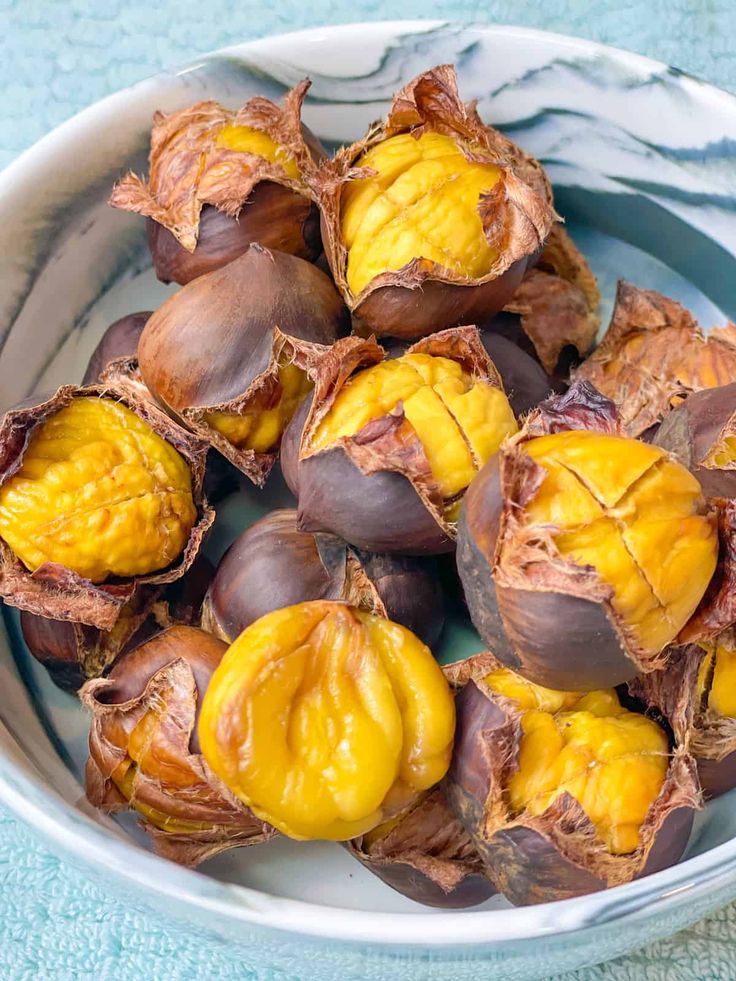 a bowl filled with nuts on top of a table