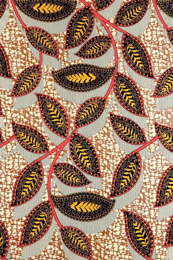 a close up view of a pattern with leaves on the side and red, yellow, and black colors