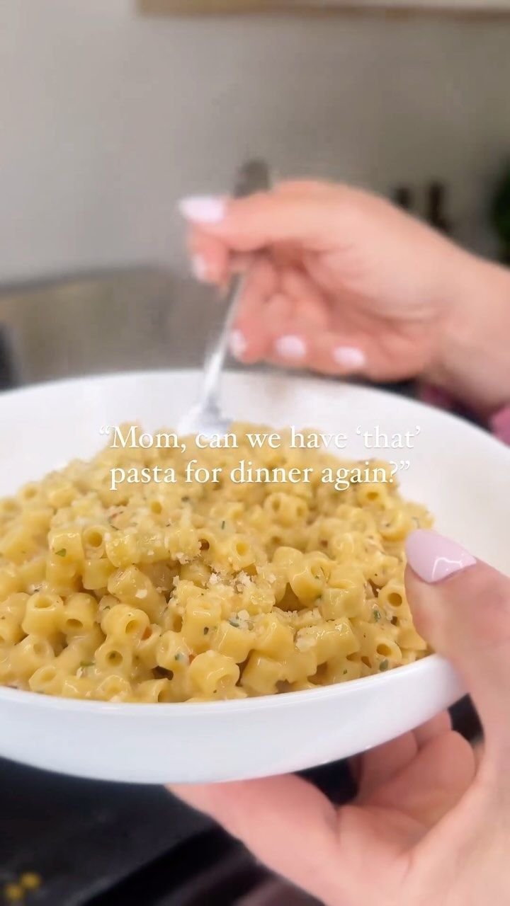 two hands holding a bowl of macaroni and cheese with the words meann'em we have that pasta for dinner again