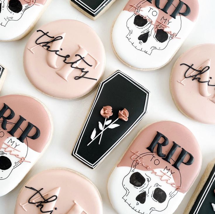 decorated cookies with the words rip and skull on them are arranged next to each other