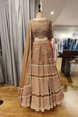 Copper attached cancan lehenga featuring sequin, glass bead hand embroidery in paisley and geometric pattern. Paired with an embroidered, padded blouse and a dupatta. - Aza Fashions Semi-stitched Hand Embellished Sets For Diwali, Hand Embellished Lehenga For Wedding And Transitional Seasons, Fitted Hand Embellished Sets For Navratri, Hand Embellished Semi-stitched Sets For Diwali, Hand Embellished Floor-length Sets For Diwali, Fitted Hand Embellished Dress For Navratri, Traditional Hand Embellished Georgette Choli, Navratri Fitted Hand Embellished Choli, Hand Embellished Lehenga For Eid Reception