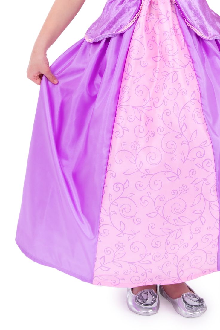 Your little princess can let their hair down in this gorgeous, comfortable Rapunzel princess dress. Soft purple velvet bodice with puffy princess sleeves Features purple and pink trims that match the "laced" up inset Two color china silk skirt decorated with a gorgegous leaf pattern Breathable, Silky Soft, 100% Polyester Fabrics Accessories Sold Separately Pink Princess Dress With Fitted Bodice, Purple Princess Fitted Ball Gown, Purple Fitted Princess Ball Gown, Princess Style Fairy Dress With Ruffles For Fancy Dress, Purple Princess Dress With Fitted Bodice, Pink Fairytale Princess Dress With Ruffles, Princess Costume With Ruffles For Fancy Dress, Purple Ruffled Princess Dress For Dress-up, Princess Costume Ball Gown