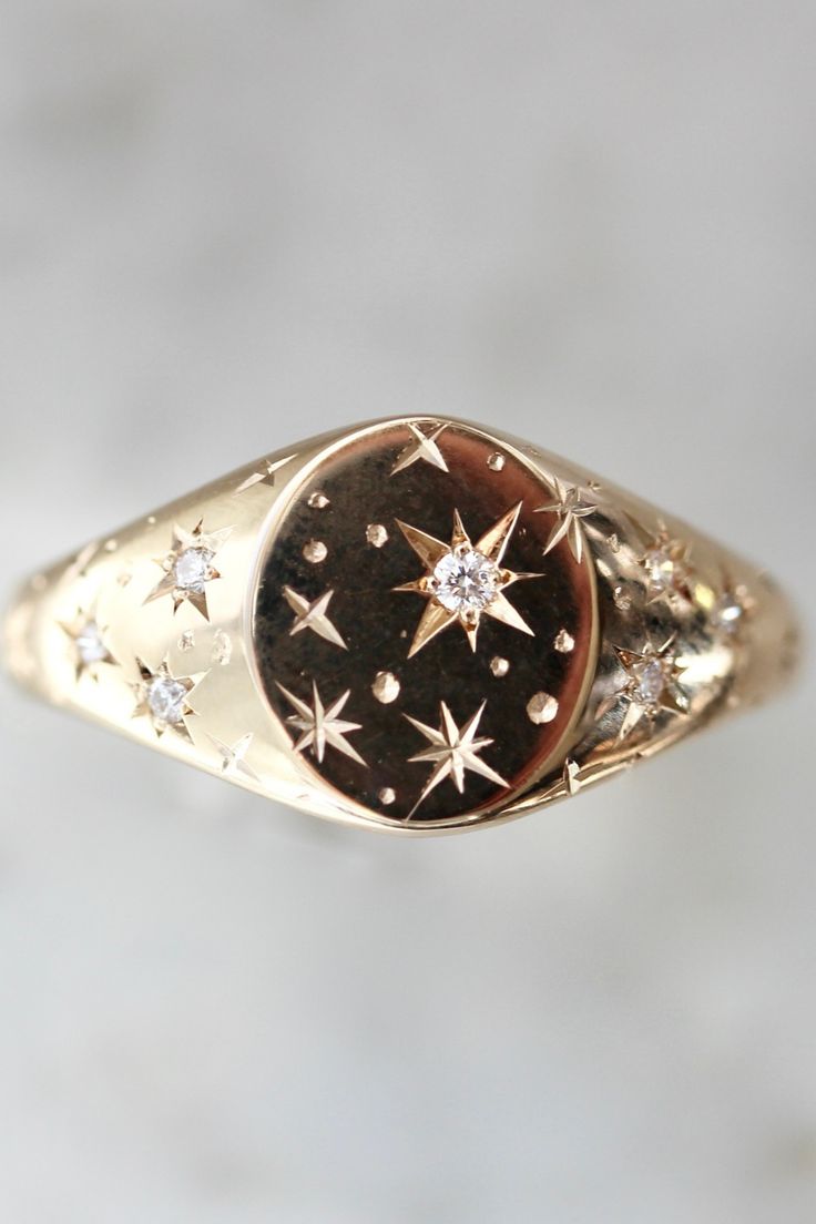 celestial engraved diamond signet ring $2,350 Redesigned Heirloom Jewelry, Unique Signet Ring, Star Signet Ring, Signet Engagement Ring, Signet Engagement Rings, Orion Star, Jewelry Engraving, Engraving Jewelry, Engravable Jewelry