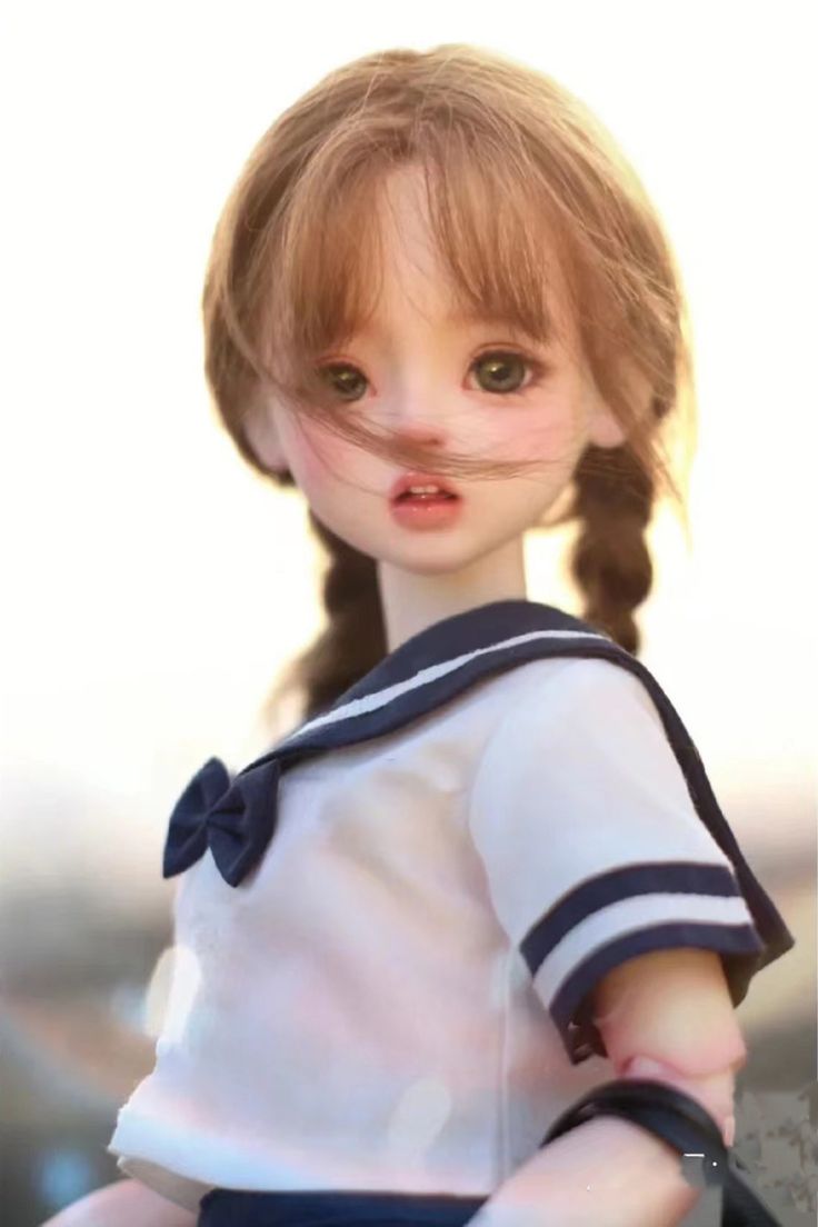 the doll is wearing a sailor's outfit