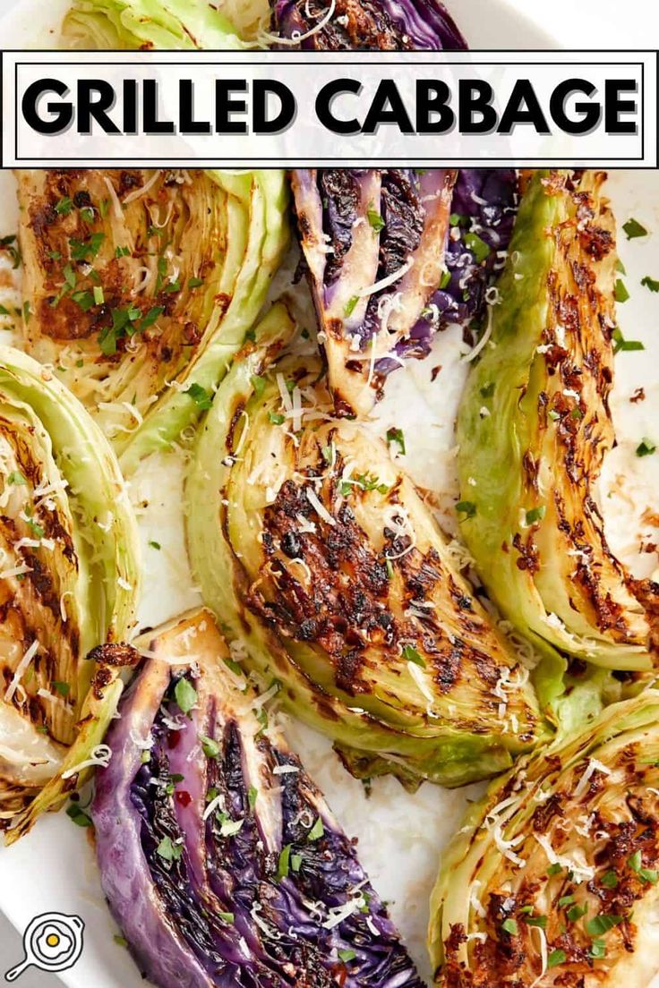 grilled cabbage on a white plate topped with parmesan cheese and garnish