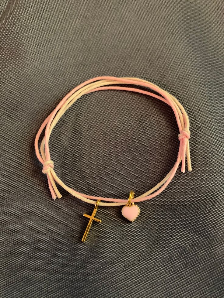 "Martyrika-Witness Bracelets- Greek Orthodox Baptism gold cross pink enamel heart Double Wax cord (baby pink/ivory) bracelets come packaged in a giftbox. What you see in the photos are samples; I will re-create your bracelets as close as I can to what you see, or in any variation you would like. Martyrika is a Greek word which means '\"sign of witnessing\". Traditionally in Greek Orthodox Baptisms, Martyrika bracelets are given to the guests upon arrival at the church as an honour for attending Personalized Pink Spiritual Charm Bracelet, Adjustable Pink Gold Charm Bracelet For Gift, Personalized Pink Spiritual Friendship Bracelets, Pink Spiritual Charm Bracelet For Friendship, Pink Adjustable Cord Friendship Bracelet As Gift, Adjustable Pink Rosary Bracelet For Friendship, Pink Adjustable Rosary Bracelet For Friendship, Adjustable Pink Friendship Bracelets With Heart Charm, Adjustable Pink Cross Bracelet