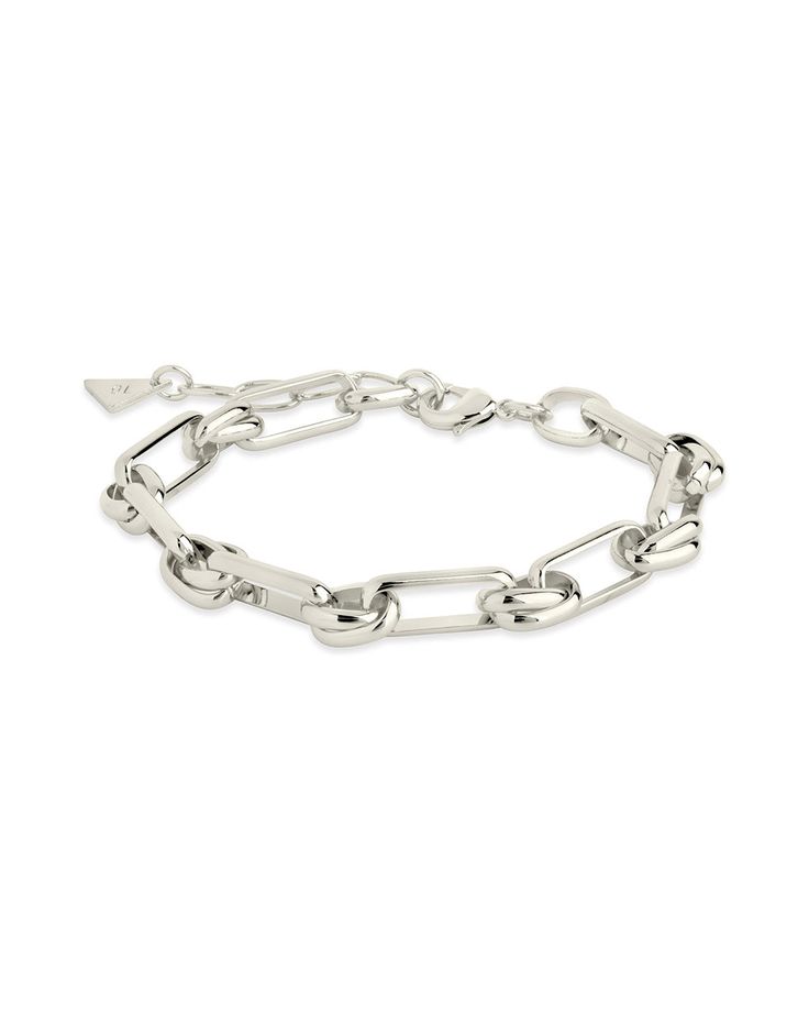 Make a statement with the Wilma Bracelet; crafted with a bold paperlink chain featuring unique links, it is the perfect accessory for adding a touch of modern elegance to any ensemble. Material: 14K gold or rhodium plated brass Features: Measures 7" with 1.25" extender, 0.3" width, Lead & Nickel free, lobster clasp Trendy Metal Link Bracelets, Metal Charm Bracelet With Rectangular Links, Modern Silver Link Chain Bracelet, Modern Metal Chain Bracelets, Modern Paperclip Link Bracelet For Gift, Modern Link Paperclip Bracelet As Gift, Metal Paperclip Bracelet With Chunky Oval Link, Metal Paperclip Bracelet With Chunky Chain Link, Modern Chunky Chain Paperclip Bracelet