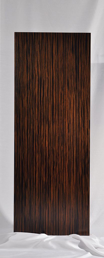 an abstract photograph of wood grained in brown and black on a white background,