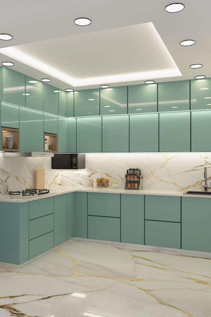 a kitchen with marble counter tops and blue cabinets, along with lights on the ceiling