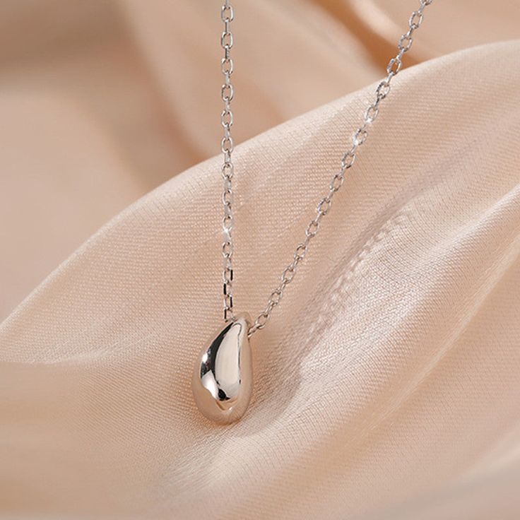 Description & Details Simple water droplet element design, classic and versatile, understated and independent, very beautiful and feminine, and exuding a literary and artistic personality, giving people a low-key and gentle feeling, allowing women's gentle temperament to be freely displayed, and the temperament index continues to rise. • Material: Solid 925 Sterling Silver• Finish: Hypoallergenic ∙ Gold Plating• Dimensions: 11 x 5.7 mm teardrop, 40 - 45 cm chain, adjustable• All our work is cust Elegant Silver Water Drop Earrings, Elegant Hypoallergenic Pendant Necklaces, Elegant Hypoallergenic Pendant Necklace, Classic Teardrop Drop Necklace Gift, Elegant Pear-shaped Drop Necklace Gift, Classic Silver Teardrop Pendant, Elegant Everyday Drop Necklace With Clavicle Chain, Classic Silver Drop Necklace, Elegant Silver Water Drop Jewelry