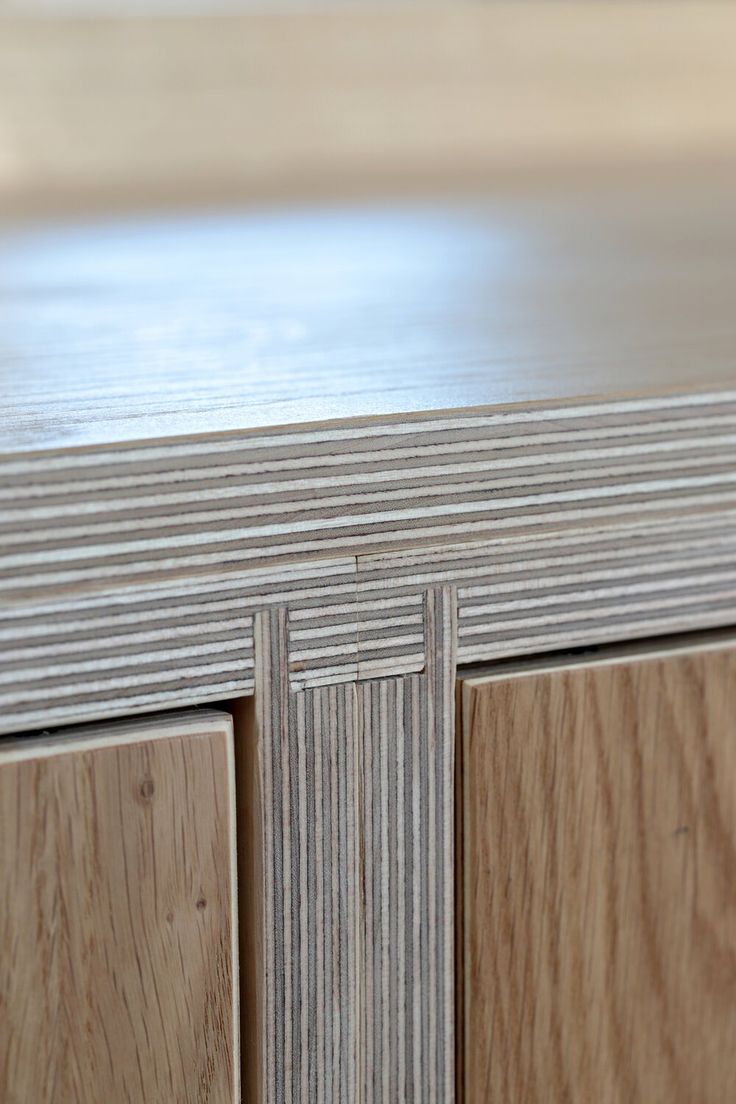 a close up view of the wood grains on this cabinet door and drawer fronts