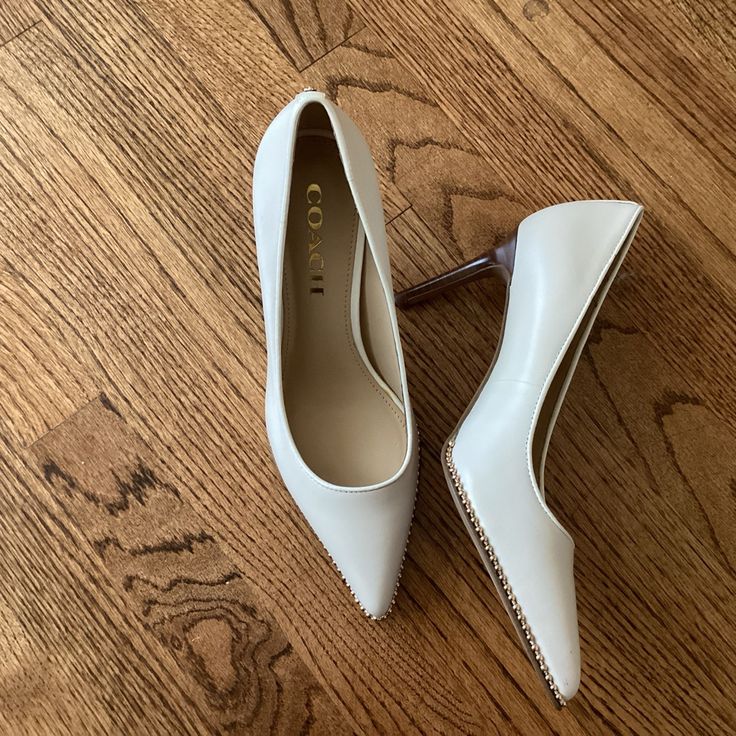 Nwot - Never Worn Ivory Coach Stiletto Heels With Goal Studs Cream Heels With Reinforced Heel For Office, Coach Pointed Toe Heels Medium Width, Coach Heels With Pointed Toe Medium Width, Coach Almond Toe Heels For Spring, Chic Coach Almond Toe Heels, Spring Coach Almond Toe Heels, Classic Coach Almond Toe Heels, Coach Heels With 4-inch Heel For Spring, Coach Closed Toe Heels For Office