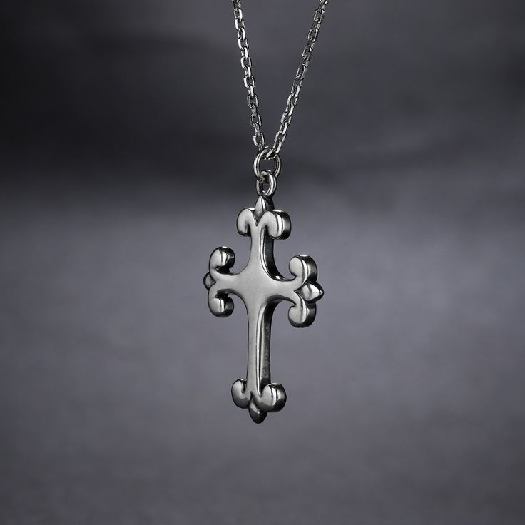 A deep and devoted connection to faith is something to honor. Express loyalty with a magnificent cross pendant. Although the design is straightforward, this pendant's elegance is unsurpassed.Material: Plating Color: Length: 450 mm Stainless Steel Cross Necklace With Clavicle Chain, White Gold Cross Necklace With Clavicle Chain, Elegant Stainless Steel Cross Pendant Necklace, Elegant Stainless Steel Cross Necklace, Elegant Stainless Steel Cross Necklace As Gift, Classic Silver Cross Pendant Necklace, Classic Silver Pendant Cross Necklace, Elegant Sterling Silver Cross Charms And Jewelry, Elegant Sterling Silver Cross Jewelry And Charms