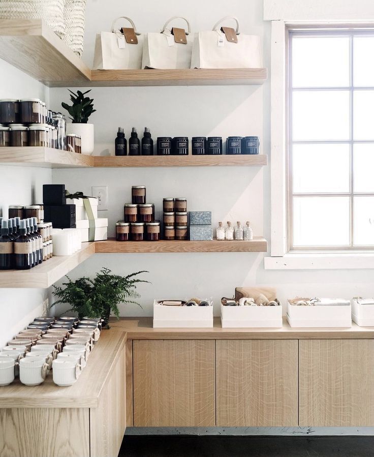 the shelves in this store are filled with different types of items and containers on them