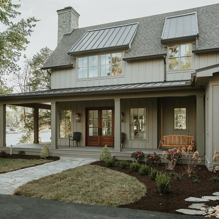 a large house with a porch and covered patio