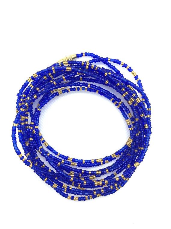 Sparkly Blue and Gold waist beads! Gorgeous on any skin tone! These waist beads have metallic clasps.Waist beads, African waist beads, Belly Chain, Belly Beads**** PROPERLY MEASURE YOUR WAIST ****Place the measuring tape at the exact area you prefer to wear the waist beads.Do not tuck in your stomach when measuring for belly chain.Allow for wiggle space when measuring for breathing room.Thank you for shopping with us! Gold Waist Beads, Waist Beads African, Belly Beads, African Waist Beads, Waist Jewelry, Breathing Room, Ankle Jewelry, Belly Jewelry, Waist Beads