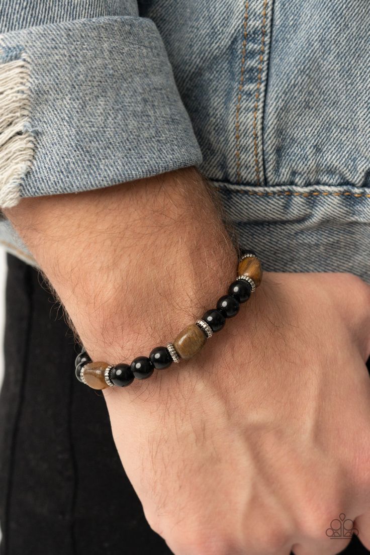 Infused with dainty silver accents, glassy black and tiger's eye stone beads are threaded along a stretchy band around the wrist for a stackable seasonal look. Sold as one individual bracelet. Paparazzi Jewelry Images, Brown Tiger Eye, Brown Bracelet, Wooden Bracelet, Paparazzi Accessories, Mens Beaded Bracelets, Tiger Eye Stone, Eye Stone, Stretchy Bracelets