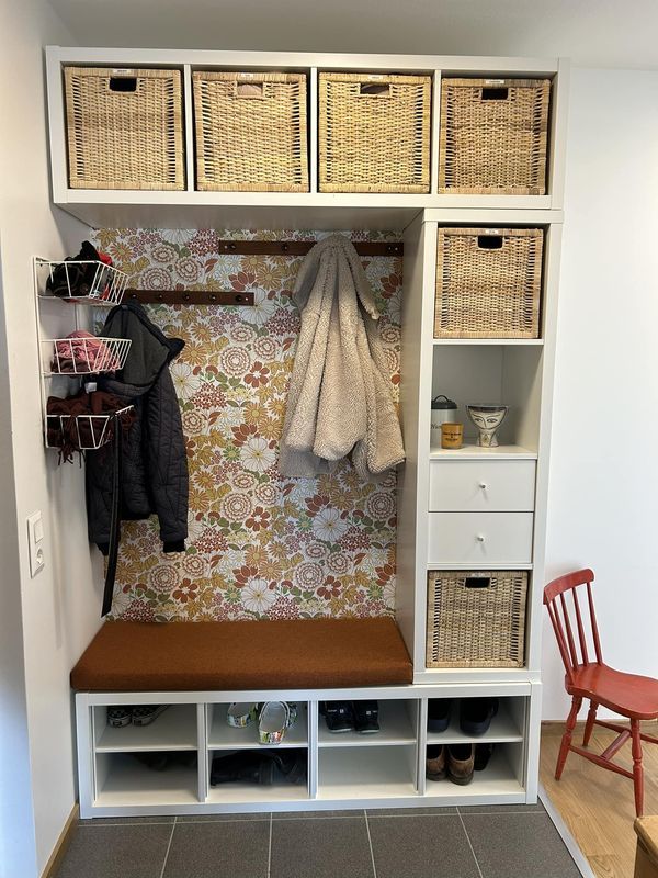 a bench and some baskets in a room