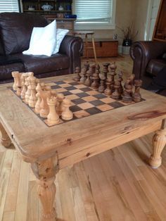 a wooden chess set sitting on top of a coffee table