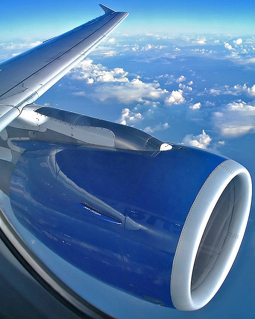 the wing of an airplane flying above the clouds