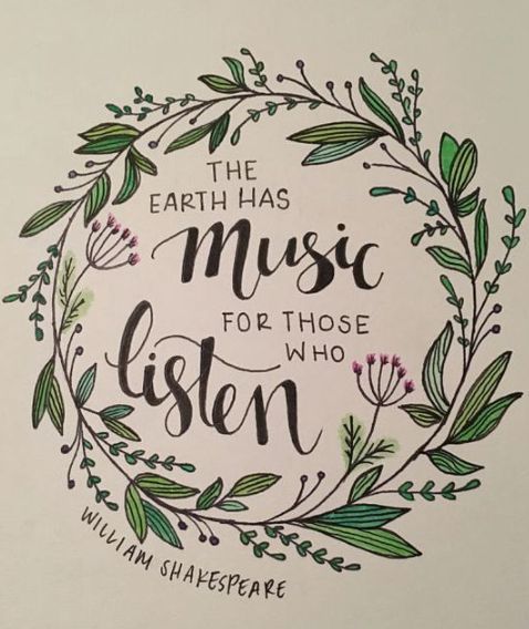 the earth has music for those who listen written in a circle surrounded by greenery